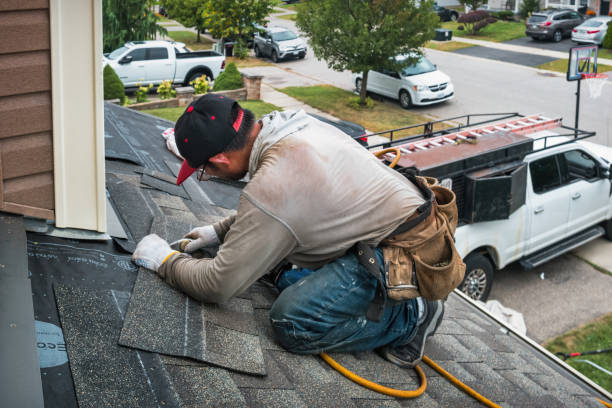 Professional Roofing technician working in East Bethany, NY